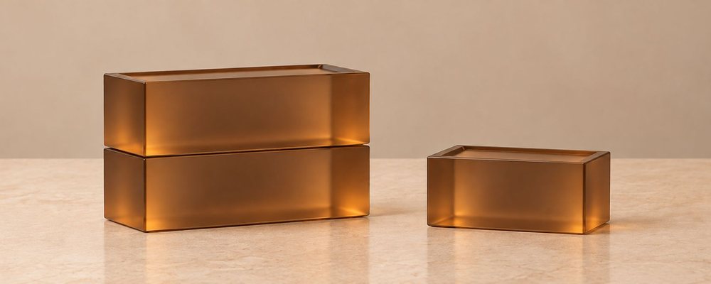 Stacked full bricks and a half brick in amber resin